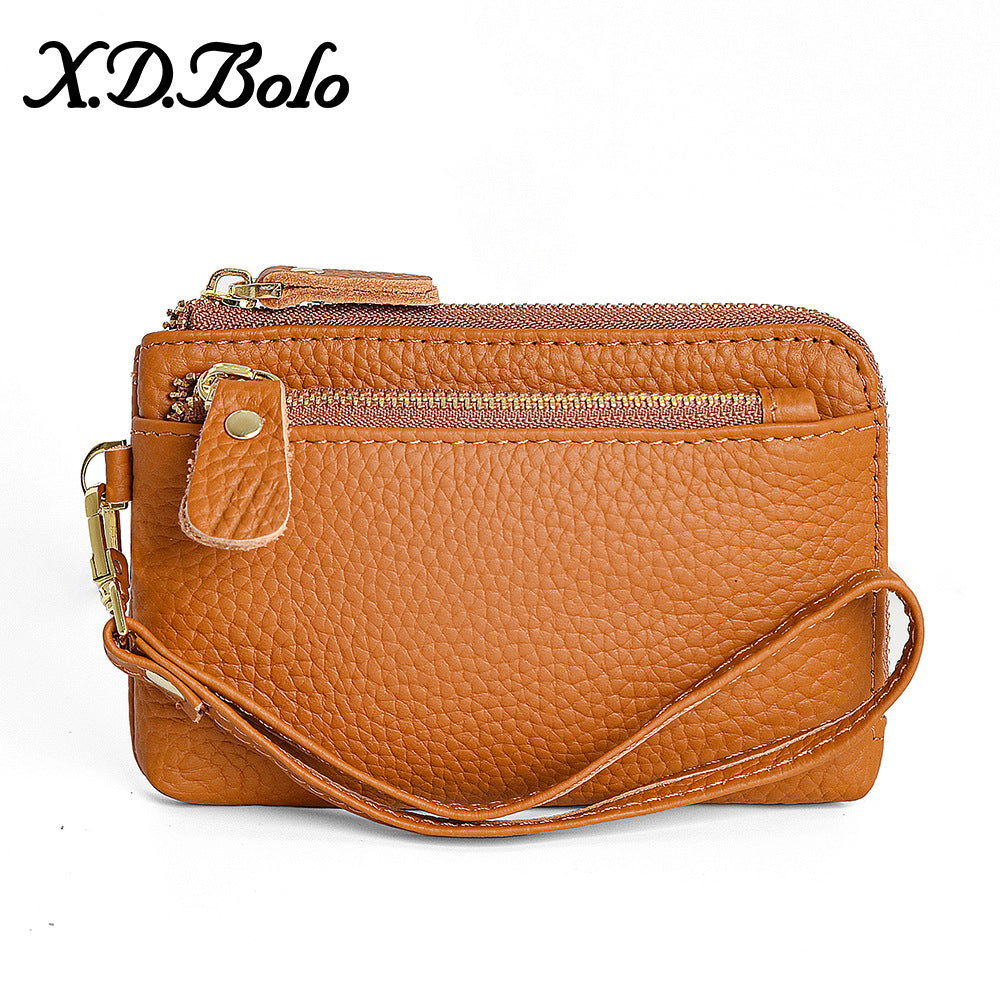 Brown leather compact wallet with three card slots and coin pocket