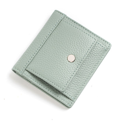 Light green cowhide wallet showing stitched front pocket and snap