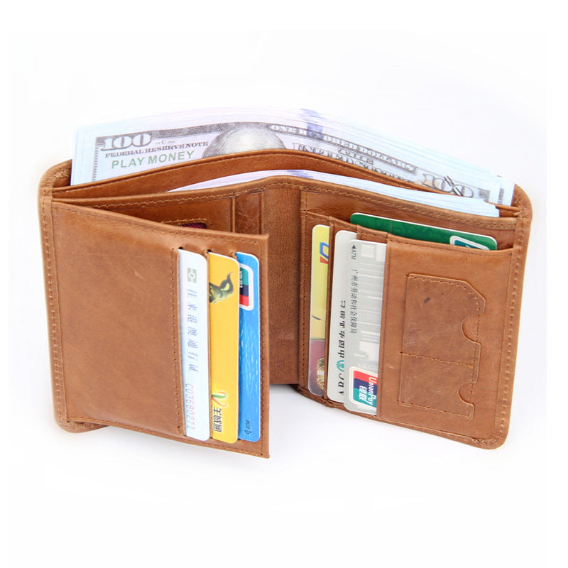 Brown bifold wallet fully open displaying cash compartment and card slots with sample cards inserted