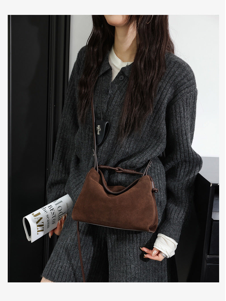 Brown crossbody shoulder bag styled with a knit outfit
