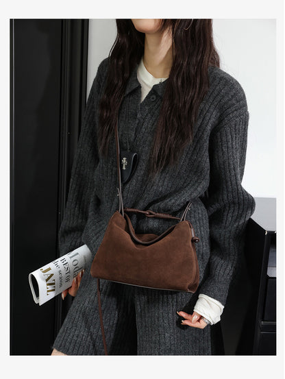 Brown crossbody shoulder bag styled with a knit outfit