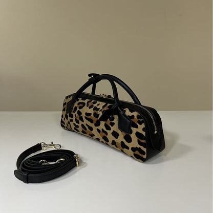 Leopard-print cowhide bag shown from a front three-quarter angle