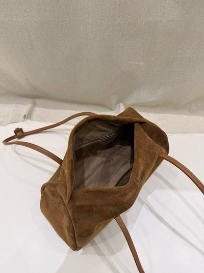 Slim side profile of the caramel shoulder tote