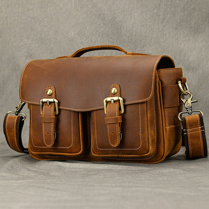 Three-quarter front view of brown camera crossbody bag
