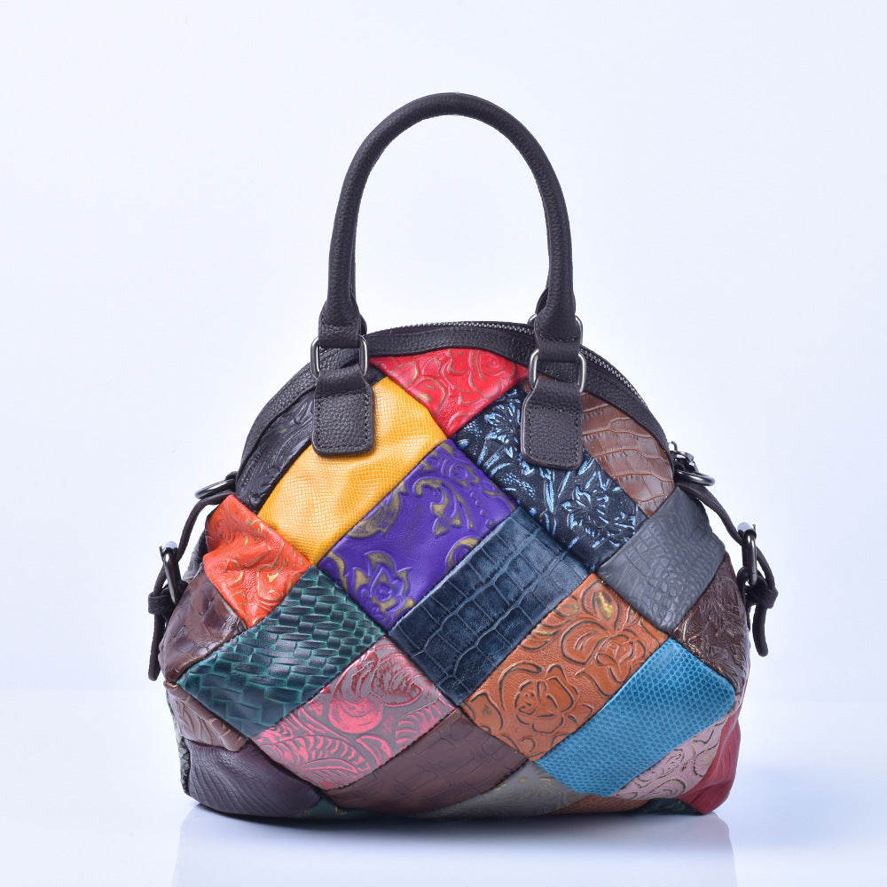 Side angle of multicolor patchwork bag with top handles and shoulder strap