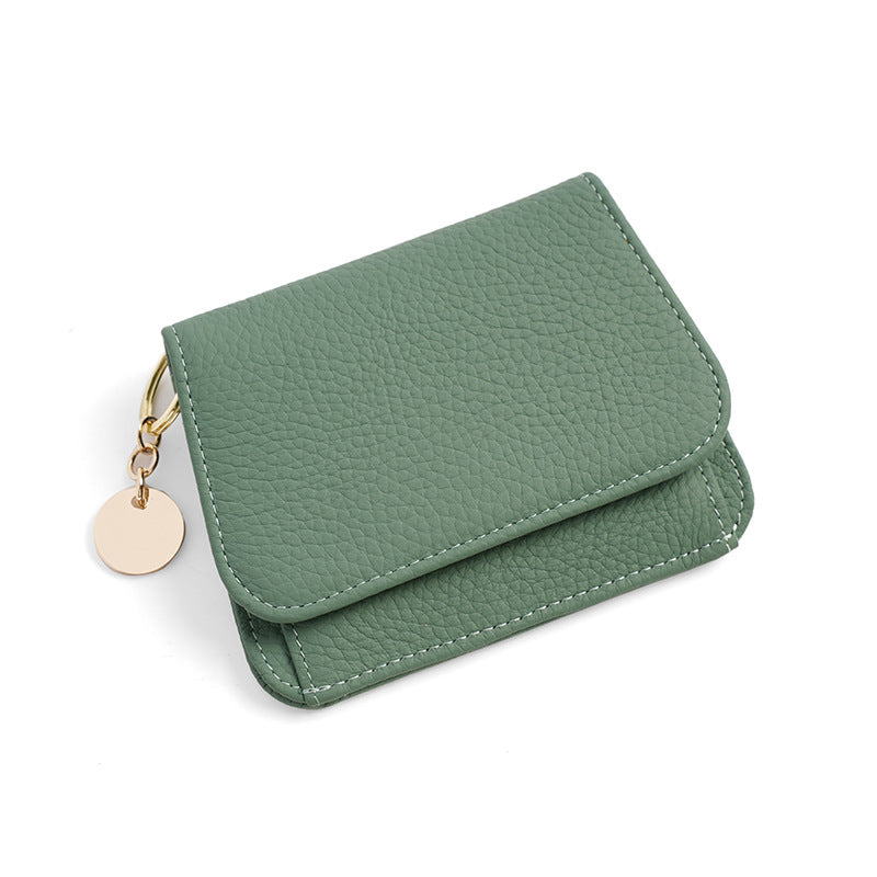 Sage green leather mini wallet with gold round keyring charm