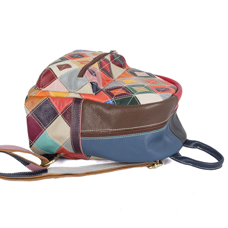Bottom view of the multicolor patchwork backpack with a zip pocket