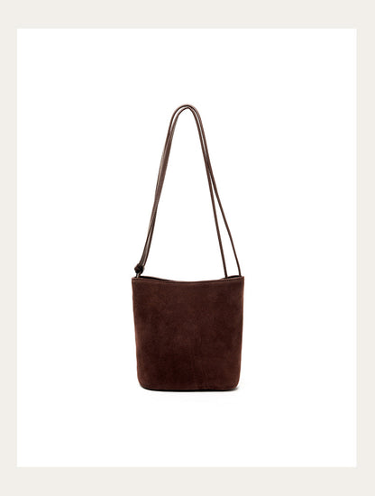Coffee nubuck bucket bag front view on plain background