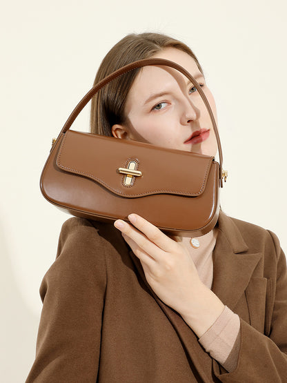 Top handle detail of cowhide leather baguette purse