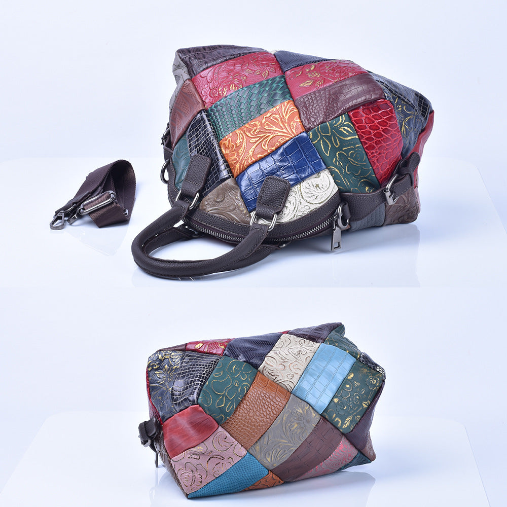 Angled view of multicolor embossed leather bag showing zip top and depth