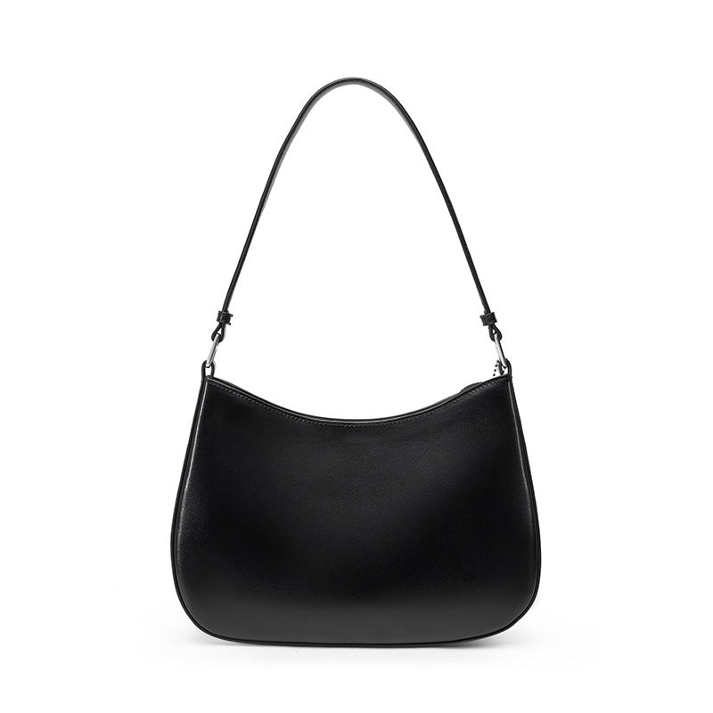 Black cowhide leather underarm shoulder bag with visible topstitching on a plain background