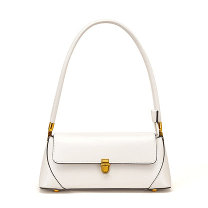 White cowhide baguette bag with antique brass hardware