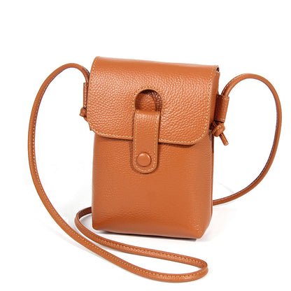 Earthy yellow pebbled cowhide leather phone bag with magnetic snap closure