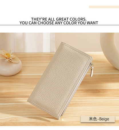 Beige long wallet displayed on a wooden surface