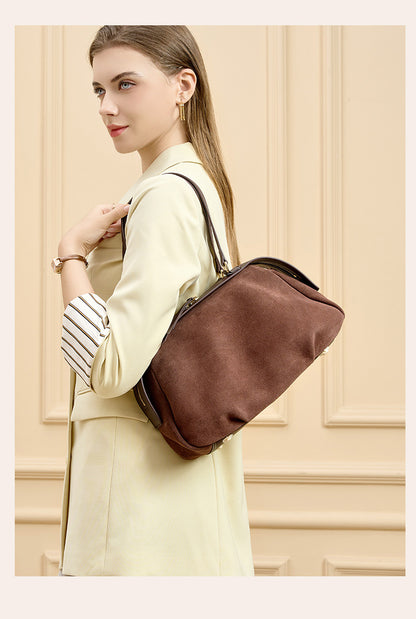 Model seated with the brown bag in front