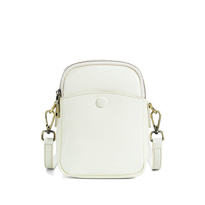 White cowhide leather mini crossbody bag showing front slip pocket detail