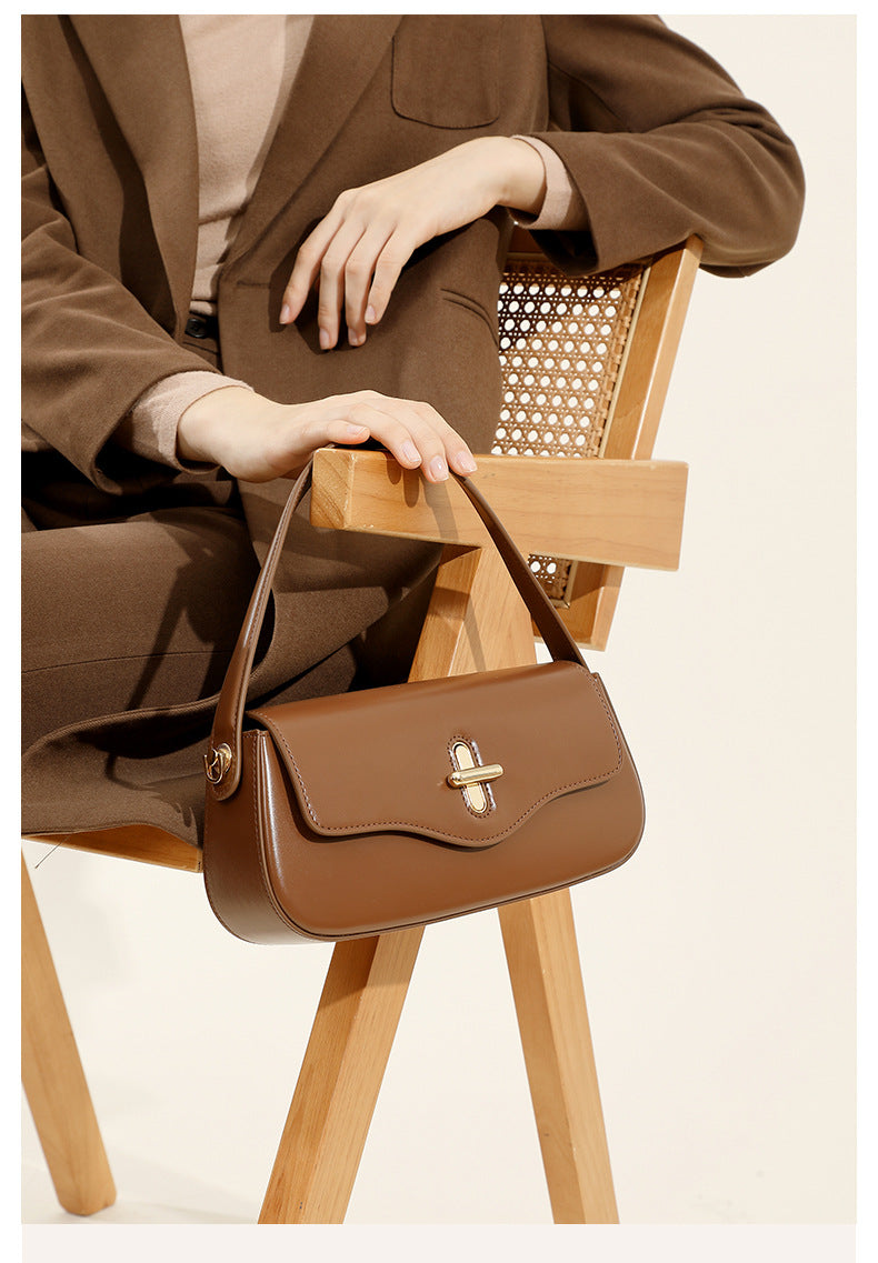 Hardware finish detail of caramel baguette shoulder bag