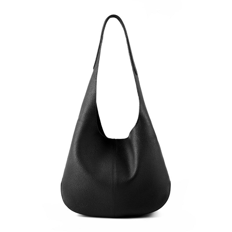 Black cowhide leather bucket tote bag on white background