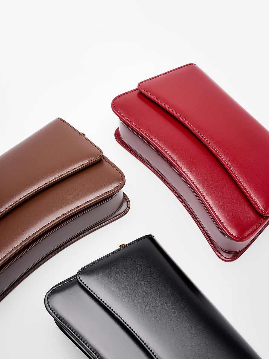 Three color lineup of black, wine red, and brown leather mini shoulder bags