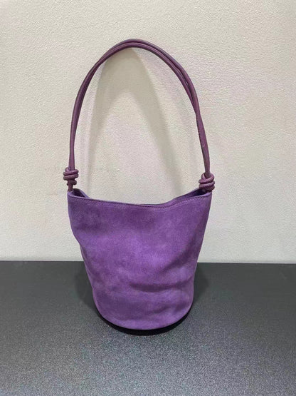 Purple bucket bag displayed from the front