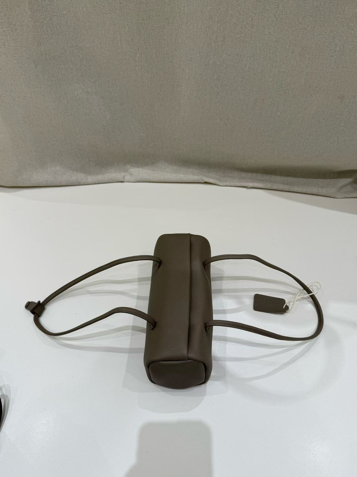 Side profile highlighting the bag's soft rectangular shape