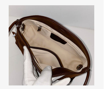 Open bag showing its lining and interior pockets