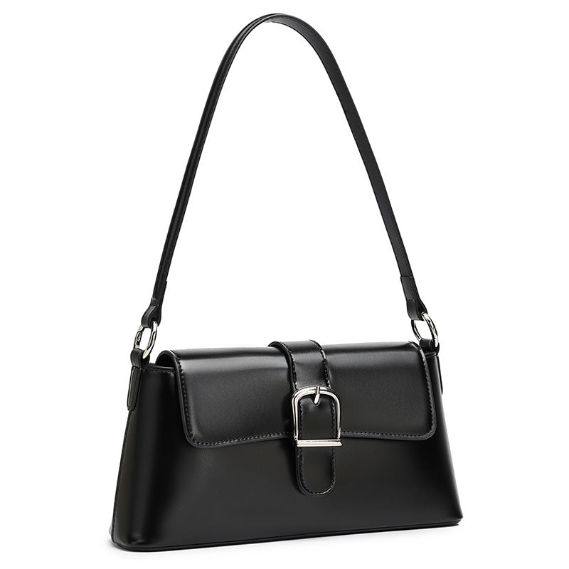 Black genuine leather baguette shoulder bag on white background