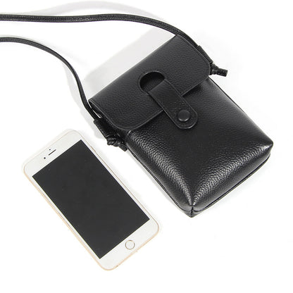 Black pebbled leather phone bag shown next to smartphone for size reference