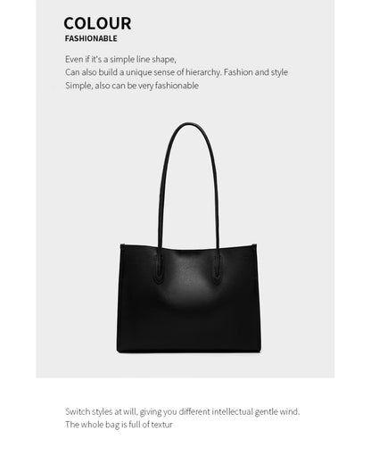 Black leather tote bag featured under the COLOUR fashion heading