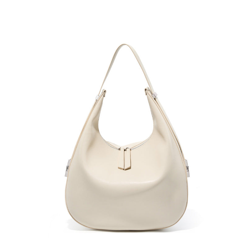 Cream white cowhide leather crescent hobo shoulder bag front view on white background, top zip and adjustable strap visible