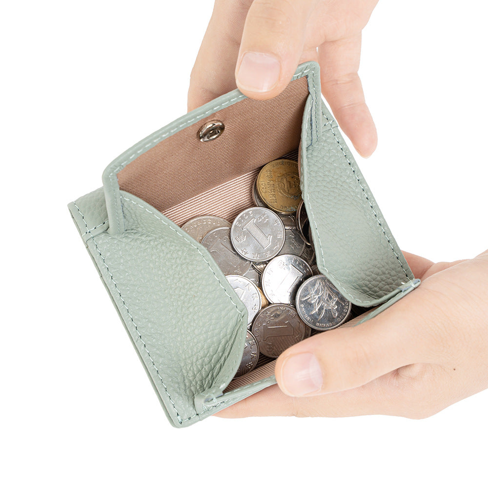 Open light green coin pocket showing space for coins