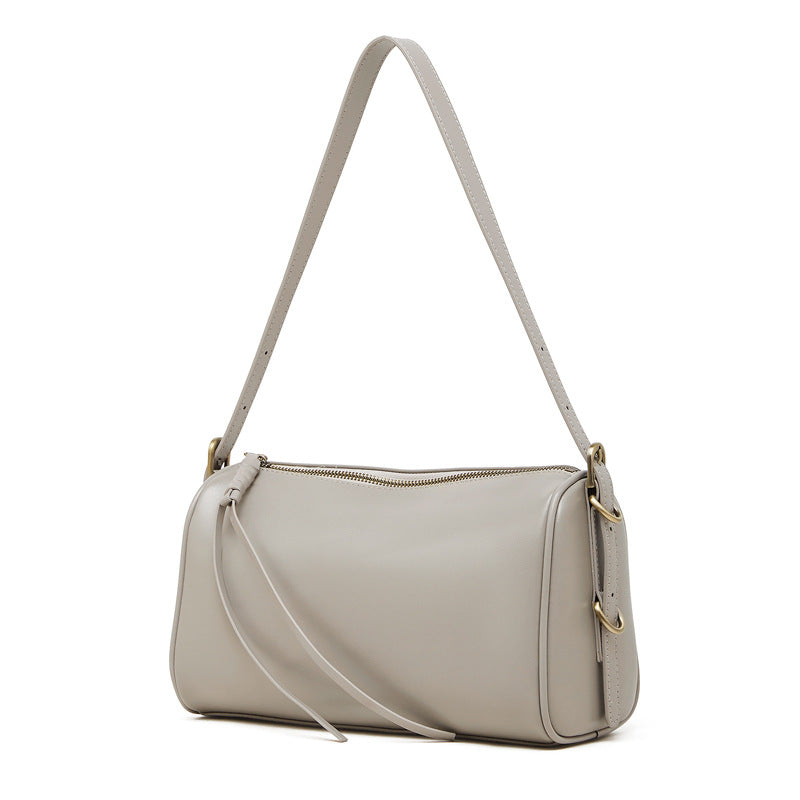 Gray cowhide leather crossbody bag front view on white background