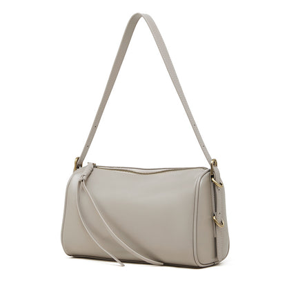 Gray cowhide leather crossbody bag front view on white background