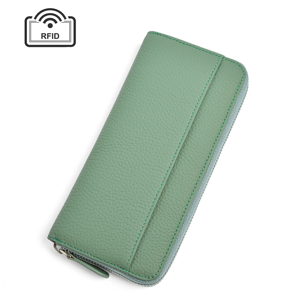 Green leather long wallet with stitching on white background
