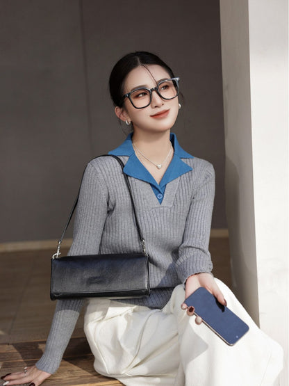 Model wearing the black horizontal flap bag