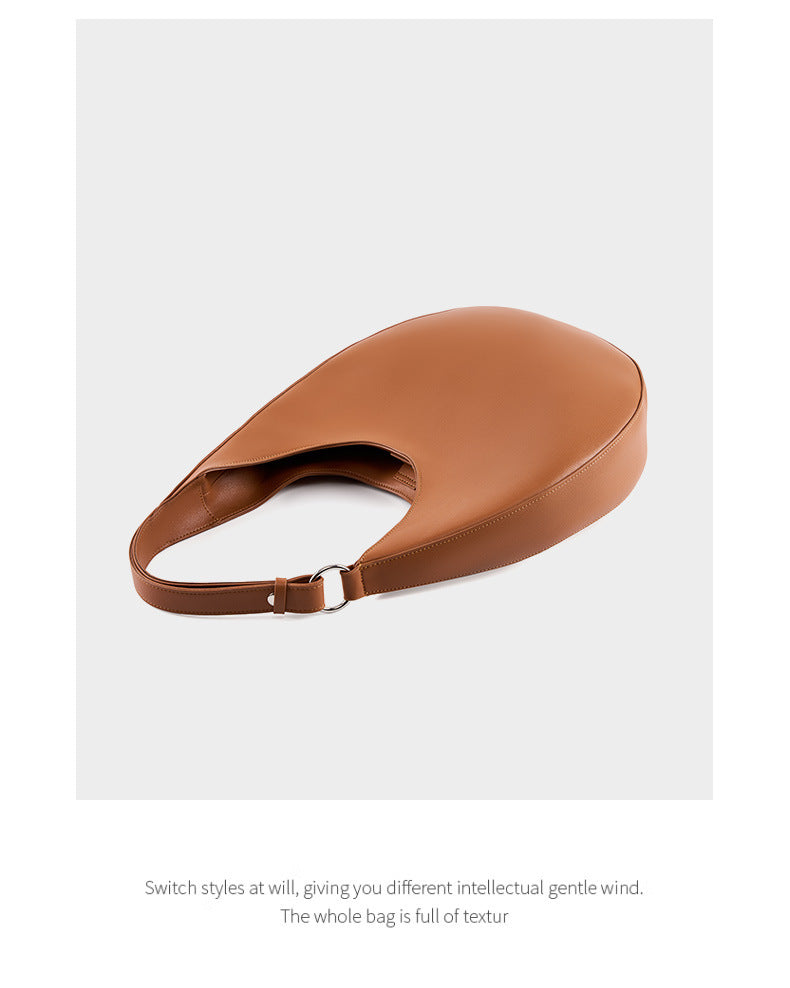 Top view of the brown bag and its single shoulder strap