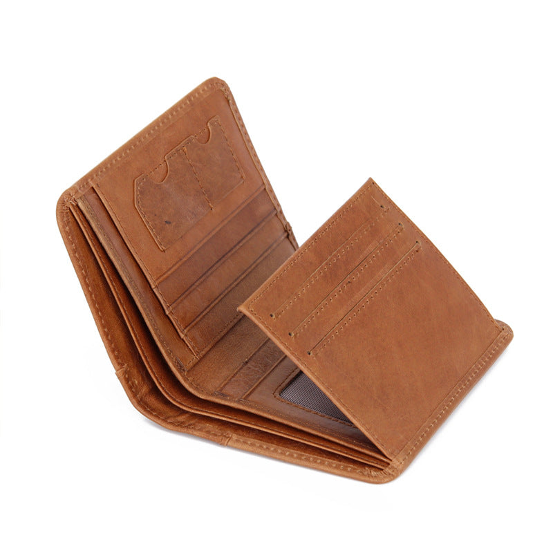 Open view of brown leather bifold wallet showing multiple card slots and ID window