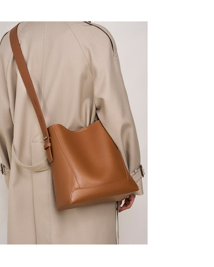 Model wearing Golden Brown bucket bag crossbody