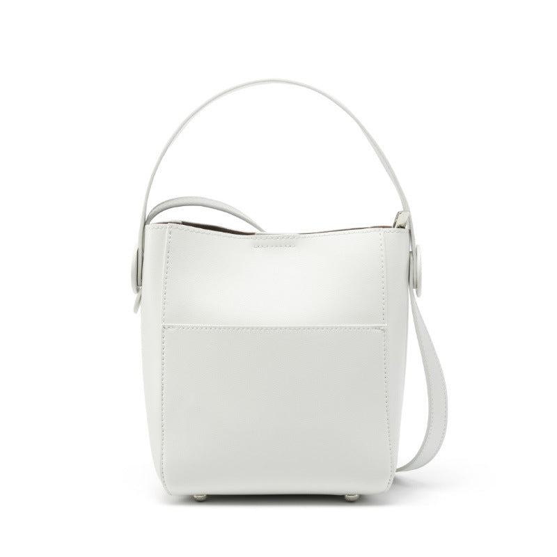 Off-white cowhide leather bucket crossbody bag on plain white background