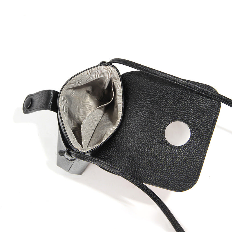 Open interior view of black phone bag showing polyester lining and slip pocket