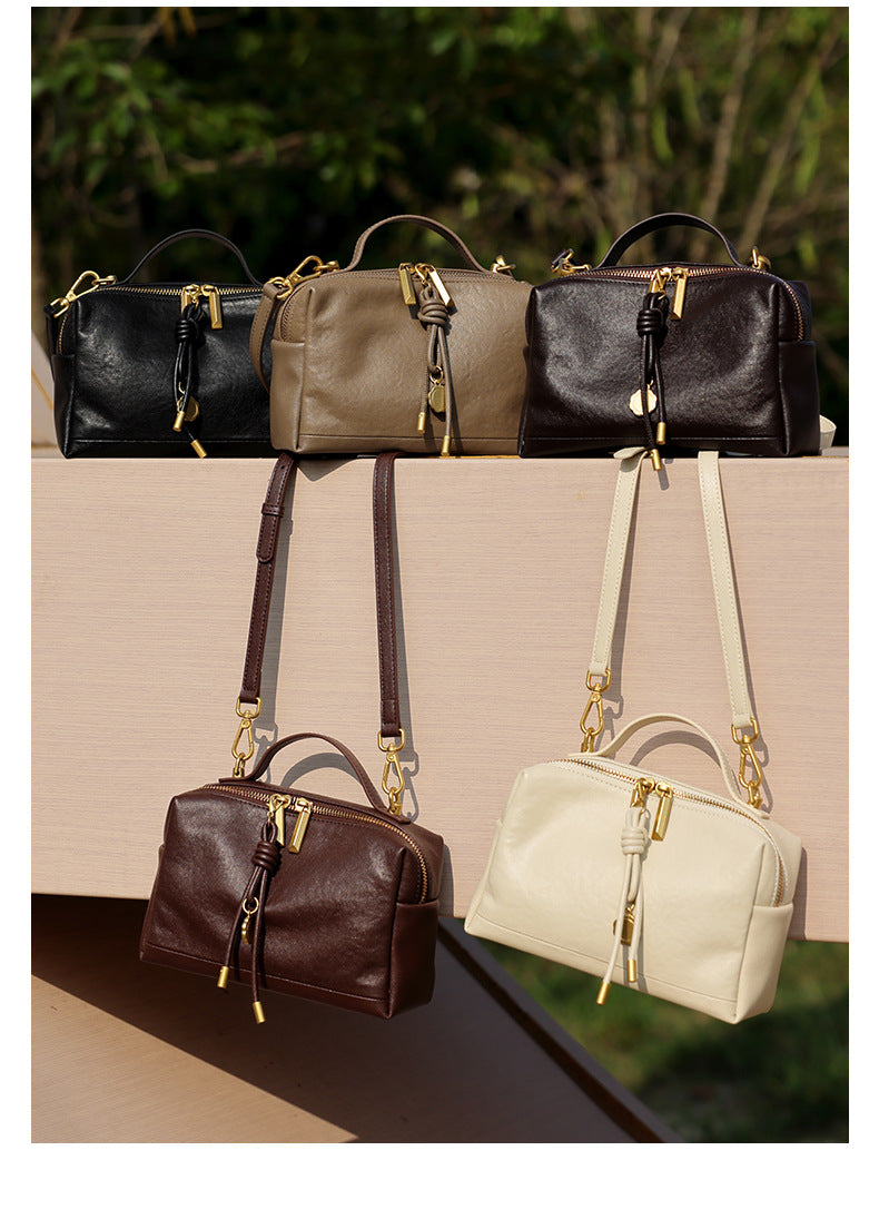 All five color variants of the cowhide leather mini crossbody bag displayed together