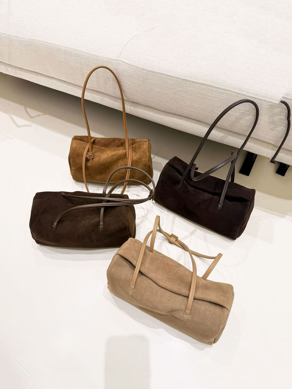Black tote photographed on a chair, front view