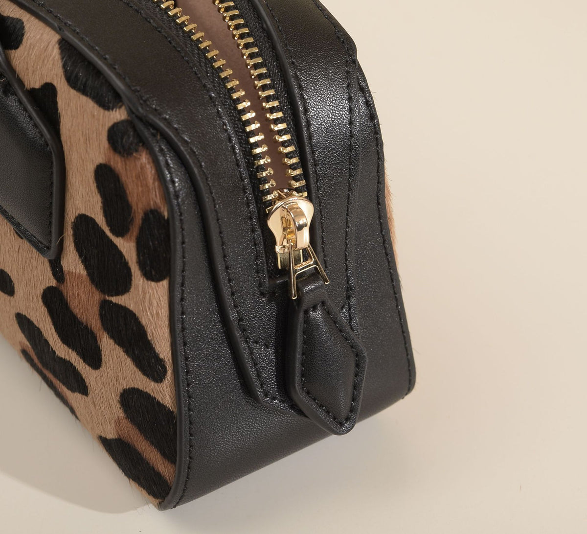 Close-up of handle attachment and leopard-print hair texture