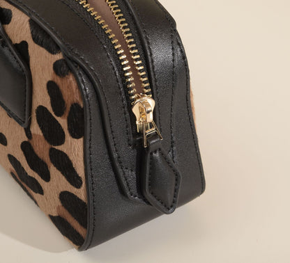 Close-up of handle attachment and leopard-print hair texture