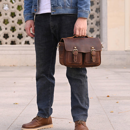 Brown camera bag carried by its top handle