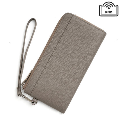 Light grey pebbled cowhide long zip clutch with wrist strap and RFID-blocking icon on white background