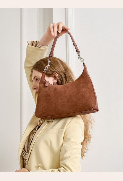 Side angle showing the brown bag’s soft silhouette