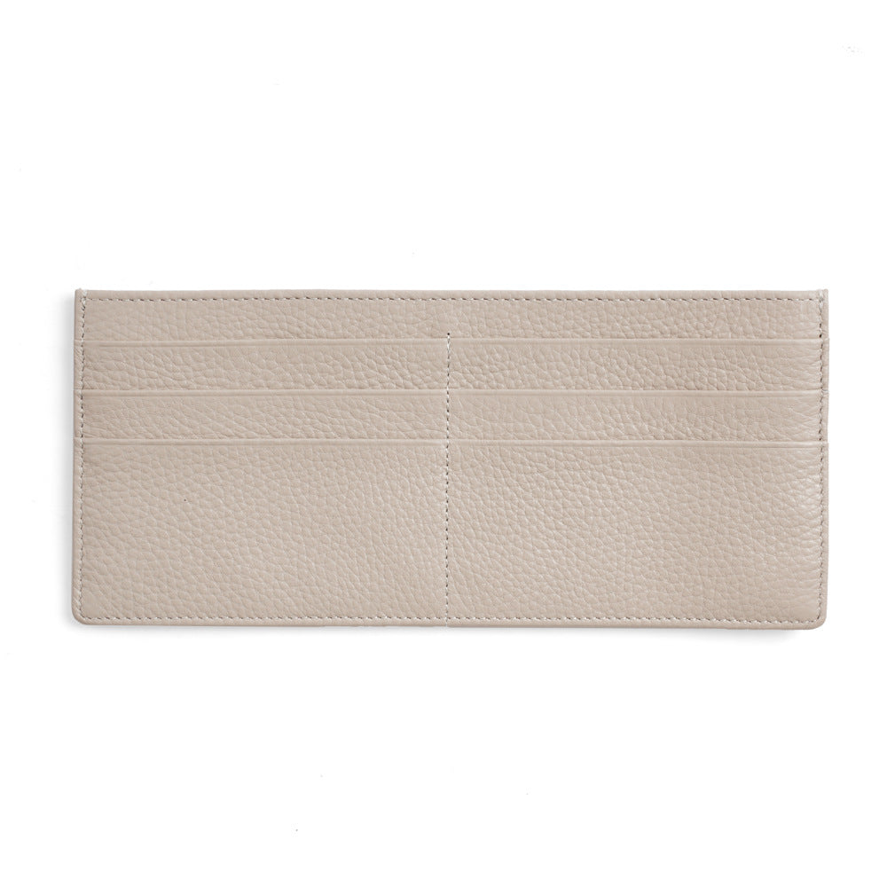 Off white slim leather wallet with stitched card slots on white background