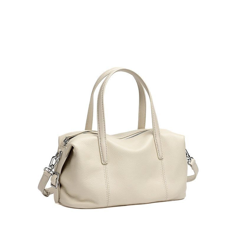 Off-white top-grain cowhide soft pillow bag on white background