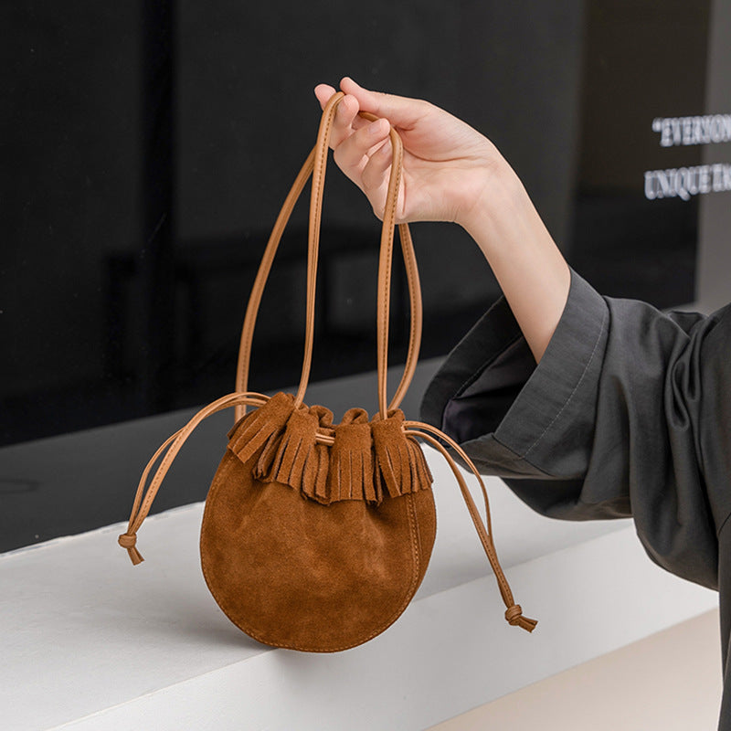 Close-up of fringe detail on the suede cowhide bag